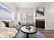 Comfortable living room with neutral decor, a fireplace, and abundant natural light at 930 N Mesa Dr # 1079, Mesa, AZ 85201