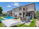Spacious backyard featuring pool, patio area and outdoor dining set at 941 W Dexter Way, San Tan Valley, AZ 85143