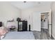 Well lit bedroom featuring wood-look floors, mirrored dresser and closet at 941 W Dexter Way, San Tan Valley, AZ 85143