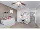 Cozy bedroom featuring neutral colors, carpet, and plenty of natural light at 941 W Dexter Way, San Tan Valley, AZ 85143