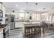 Bright eat-in kitchen with granite countertops, stainless steel appliances, and an island with seating at 941 W Dexter Way, San Tan Valley, AZ 85143