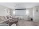 Comfortable living room showcasing a large projector screen, plush seating, and neutral decor at 941 W Dexter Way, San Tan Valley, AZ 85143
