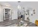 Open-concept home with wood floors, white trim, neutral colors, and pendant lighting at 941 W Dexter Way, San Tan Valley, AZ 85143