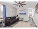 Cozy den with hardwood floors, neutral paint, a ceiling fan, and natural light from a window at 941 W Dexter Way, San Tan Valley, AZ 85143