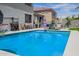 Backyard pool area with lounge chairs and covered dining area at 941 W Dexter Way, San Tan Valley, AZ 85143