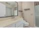 Clean bathroom with a decorative mirror, sink, and toilet at 9606 W Long Hills Dr, Sun City, AZ 85351