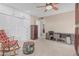 This bedroom includes built-in closet, drawers, desk, and a rocking chair at 9606 W Long Hills Dr, Sun City, AZ 85351