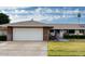 Single level home boasts mature landscaping, two car garage and neutral color palette at 9606 W Long Hills Dr, Sun City, AZ 85351
