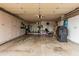 The spacious garage provides generous storage with lots of white cabinets and room for multiple vehicles at 9606 W Long Hills Dr, Sun City, AZ 85351