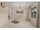Bright and airy living room with neutral walls, chandelier and a large window at 9606 W Long Hills Dr, Sun City, AZ 85351