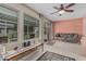 Sunroom with cozy seating and natural light streaming through large windows at 9606 W Long Hills Dr, Sun City, AZ 85351
