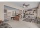 Open-concept living space featuring neutral colors and a view of dining area at 9606 W Long Hills Dr, Sun City, AZ 85351