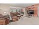 Inviting living room with leather furniture and access to screened in patio at 9606 W Long Hills Dr, Sun City, AZ 85351