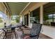 The enclosed patio features comfortable seating with outdoor furniture and neighborhood views at 9606 W Long Hills Dr, Sun City, AZ 85351