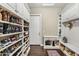 Spacious walk-in closet with custom shelving for shoes and storage at 9936 E Winter Sun Dr, Scottsdale, AZ 85262