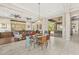Open-concept dining area with glass table and colorful chairs; flows into living space at 9936 E Winter Sun Dr, Scottsdale, AZ 85262