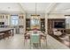 Open-concept dining room with natural light, custom built-ins, and views of the desert landscape at 9936 E Winter Sun Dr, Scottsdale, AZ 85262