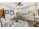 A flexible space with workout equipment, sofa, and natural light at 9936 E Winter Sun Dr, Scottsdale, AZ 85262