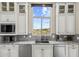 Bright kitchen with granite countertops, stainless steel appliances, and a view of the outdoors at 9936 E Winter Sun Dr, Scottsdale, AZ 85262