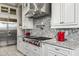Kitchen features granite countertops, stainless steel appliances, and custom cabinets at 9936 E Winter Sun Dr, Scottsdale, AZ 85262