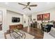 Stylish living area boasts a ceiling fan and wet bar, perfect for entertaining and relaxing in a comfortable setting at 9936 E Winter Sun Dr, Scottsdale, AZ 85262