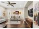 Cozy living room with neutral tones, comfortable seating, mounted tv and warm lighting, creating a relaxing atmosphere at 9936 E Winter Sun Dr, Scottsdale, AZ 85262