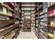Spacious walk-in pantry with custom shelving, providing ample storage for all your needs at 9936 E Winter Sun Dr, Scottsdale, AZ 85262