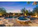 Resort-style pool with a luxurious spa and desert landscaping provides a tranquil outdoor escape at 9936 E Winter Sun Dr, Scottsdale, AZ 85262