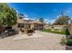 Well-maintained backyard with seating area, mature trees, and plenty of space for entertaining at 1019 W Mohawk Ln, Phoenix, AZ 85027