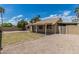 Spacious backyard featuring a covered patio, green grass, and low-maintenance landscaping at 1019 W Mohawk Ln, Phoenix, AZ 85027