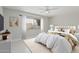 Cozy bedroom featuring a large window, soft carpet, and neutral decor at 1019 W Mohawk Ln, Phoenix, AZ 85027