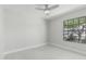 Bright bedroom features neutral paint, updated flooring, and a window for natural light at 1019 W Mohawk Ln, Phoenix, AZ 85027