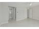 Spacious bedroom with tile floors, a walk-in closet and access to the bathroom at 1019 W Mohawk Ln, Phoenix, AZ 85027