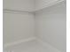 A simple, walk-in closet features a pipe for hanging clothes at 1019 W Mohawk Ln, Phoenix, AZ 85027