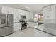 Bright kitchen featuring stainless steel appliances, granite countertops, and ample cabinet space at 1019 W Mohawk Ln, Phoenix, AZ 85027