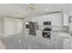 Gleaming white kitchen featuring stainless steel appliances and ample counter space at 1019 W Mohawk Ln, Phoenix, AZ 85027