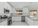 Well-appointed kitchen featuring stainless steel appliances and a stylish tile backsplash at 1019 W Mohawk Ln, Phoenix, AZ 85027