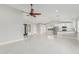 Open concept living room flows into the kitchen with modern white cabinetry at 1019 W Mohawk Ln, Phoenix, AZ 85027