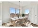 Eat-in dining area with a view, a modern table setting, and natural light at 11203 E Crescent Ave, Mesa, AZ 85208
