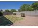 Grass area, desert landscaping, and block wall provide privacy in the backyard at 11625 N 153Rd Dr, Surprise, AZ 85379