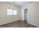 Bedroom featuring wood floors and a closet at 11625 N 153Rd Dr, Surprise, AZ 85379