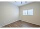 Bedroom featuring a window and wood floors at 11625 N 153Rd Dr, Surprise, AZ 85379
