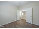 Bedroom with a closet, wood flooring, and double doors at 11625 N 153Rd Dr, Surprise, AZ 85379