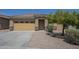 Inviting single-Gathering home with a tile roof, desert landscaping, and a two-car garage at 11625 N 153Rd Dr, Surprise, AZ 85379