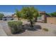 Landscaped front yard featuring desert landscaping and mature shade tree at 11625 N 153Rd Dr, Surprise, AZ 85379