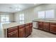 Well-equipped kitchen with an island, granite countertops, and stainless steel appliances at 11625 N 153Rd Dr, Surprise, AZ 85379