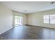 Bright living room with sliding glass doors leading to the backyard and a large window at 11625 N 153Rd Dr, Surprise, AZ 85379