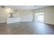 Spacious living room with sliding glass doors leading to the backyard and wood flooring at 11625 N 153Rd Dr, Surprise, AZ 85379