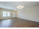 Bright and spacious living room with wood-look floors and ample natural light at 11625 N 153Rd Dr, Surprise, AZ 85379