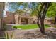Large, gravel filled backyard features a well-maintained lawn and mature landscaping at 11891 N 147Th Dr, Surprise, AZ 85379